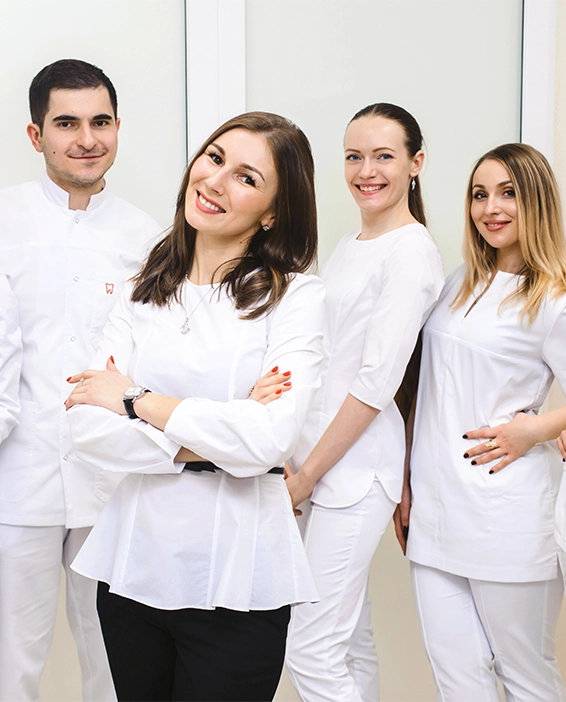 welcoming dental team ready to help patients with modern scheduling technology